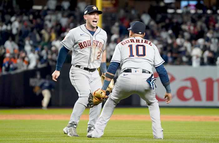 Astros third baseman Alex Bregman celebrates with first baseman Yuli Gurriel after beating the Yankees to clinch the AL pennant.